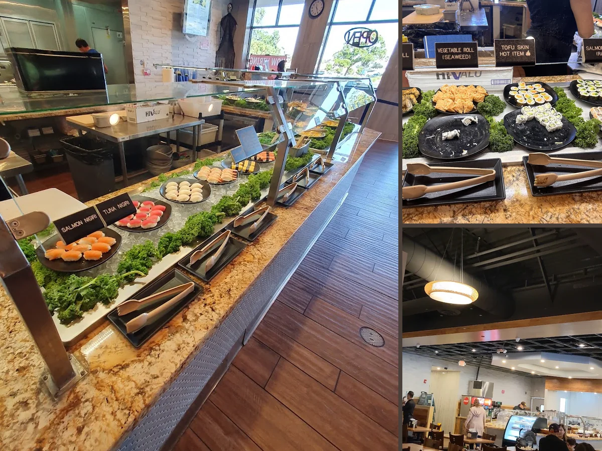 Buffet line with varied hot dishes and sushi rolls.